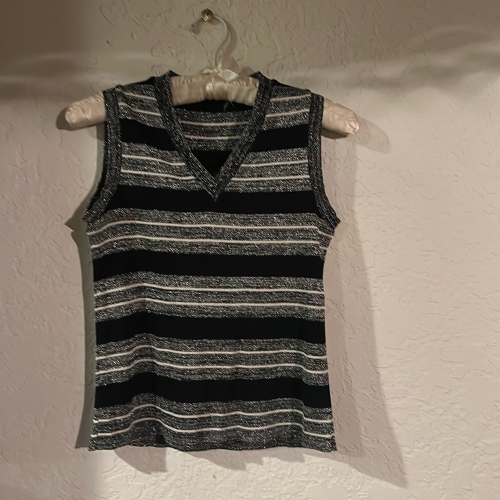 Sparkly sleeveless pullover with v-neckline. Black, white and silver. Small.